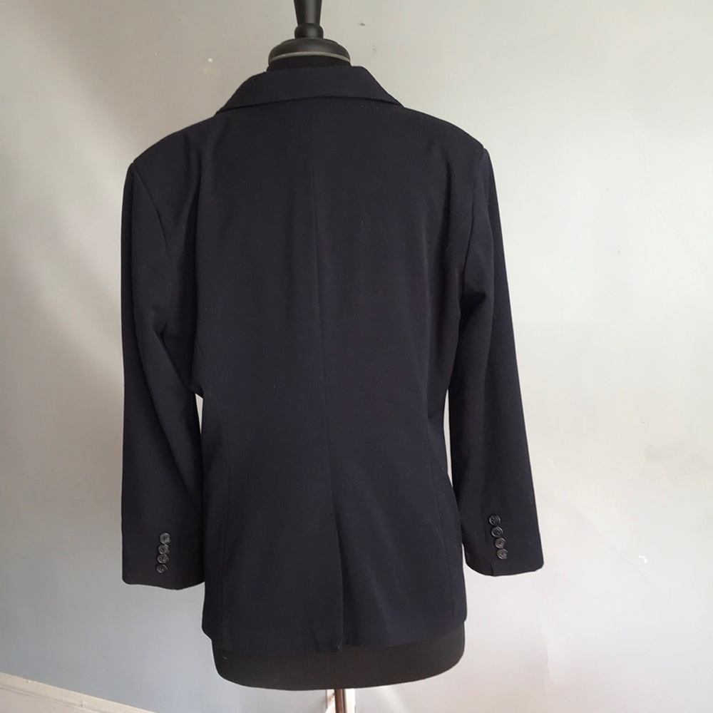 Classic navy jacket, dresses up jeans, goes w/ many colors! Lined, inside pkt.
